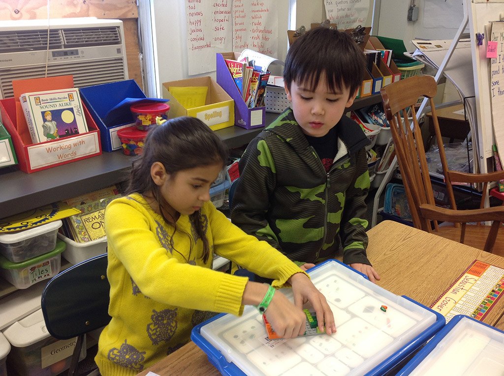 Students building a Lego kit