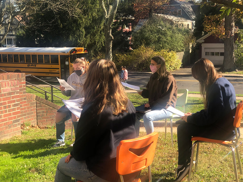 Students playing instruments outdoors