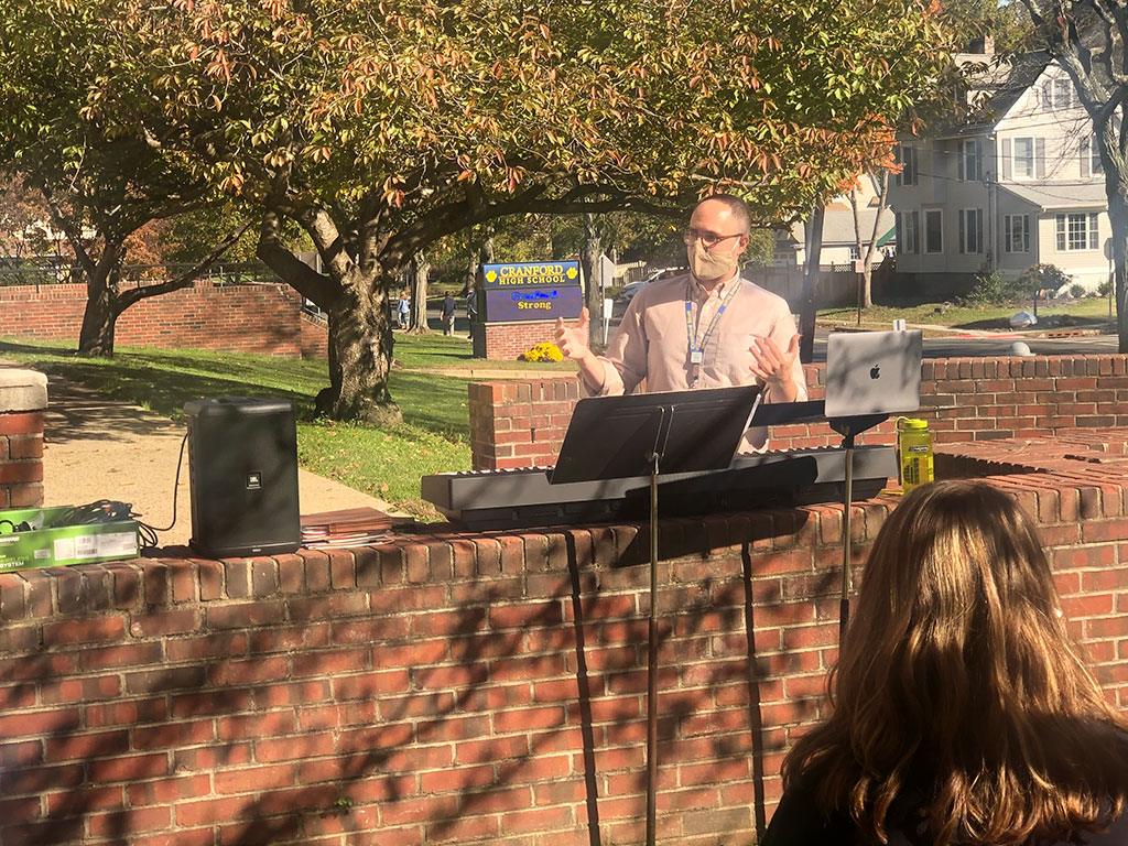 Students playing instruments outdoors