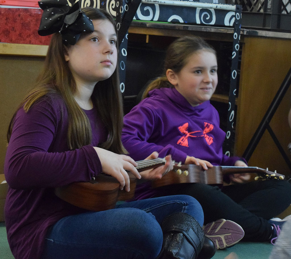 Students playing ukuleles